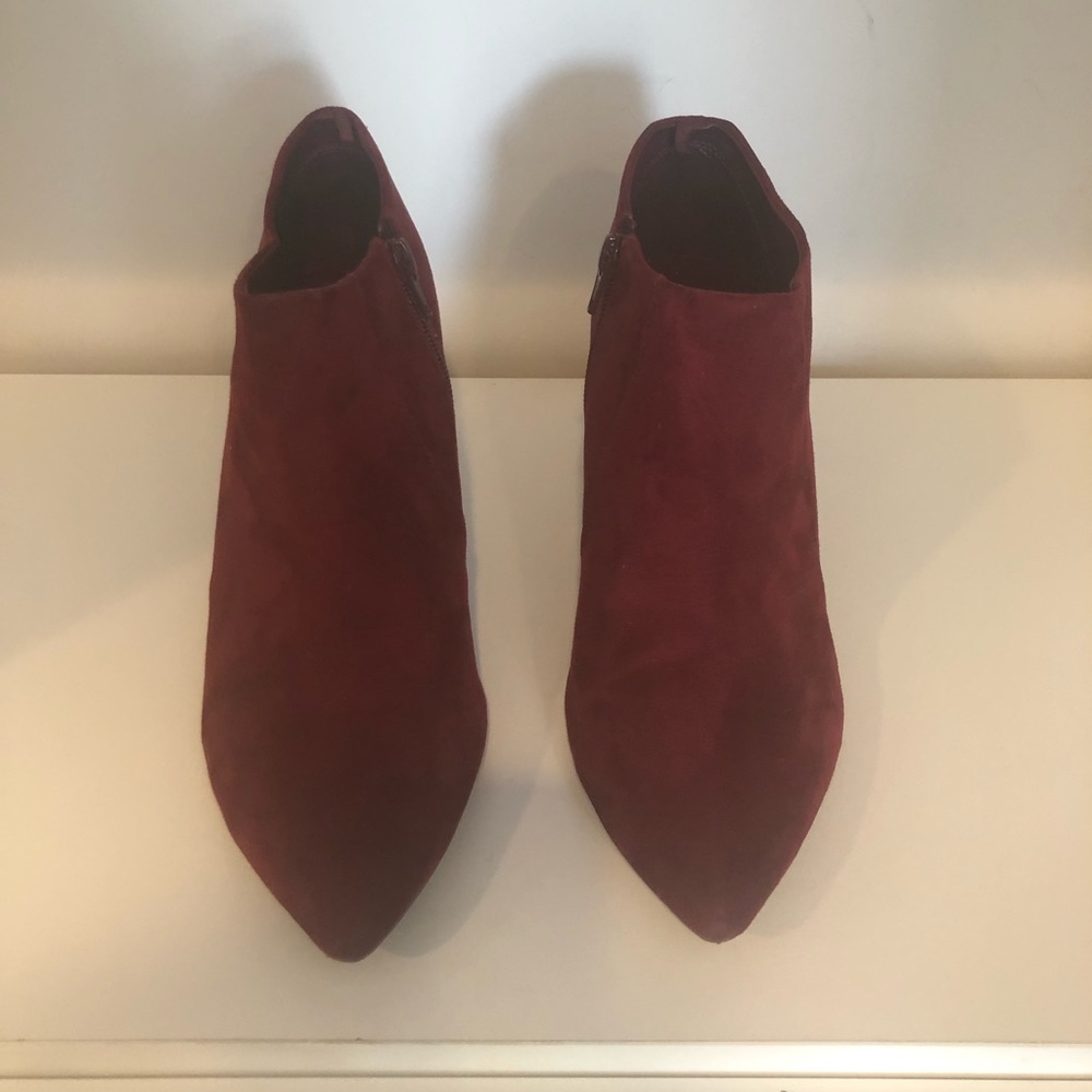 Burgundy faux suede ankle boots.